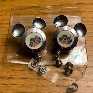 Two Disney lanyards with one plastic id pouch